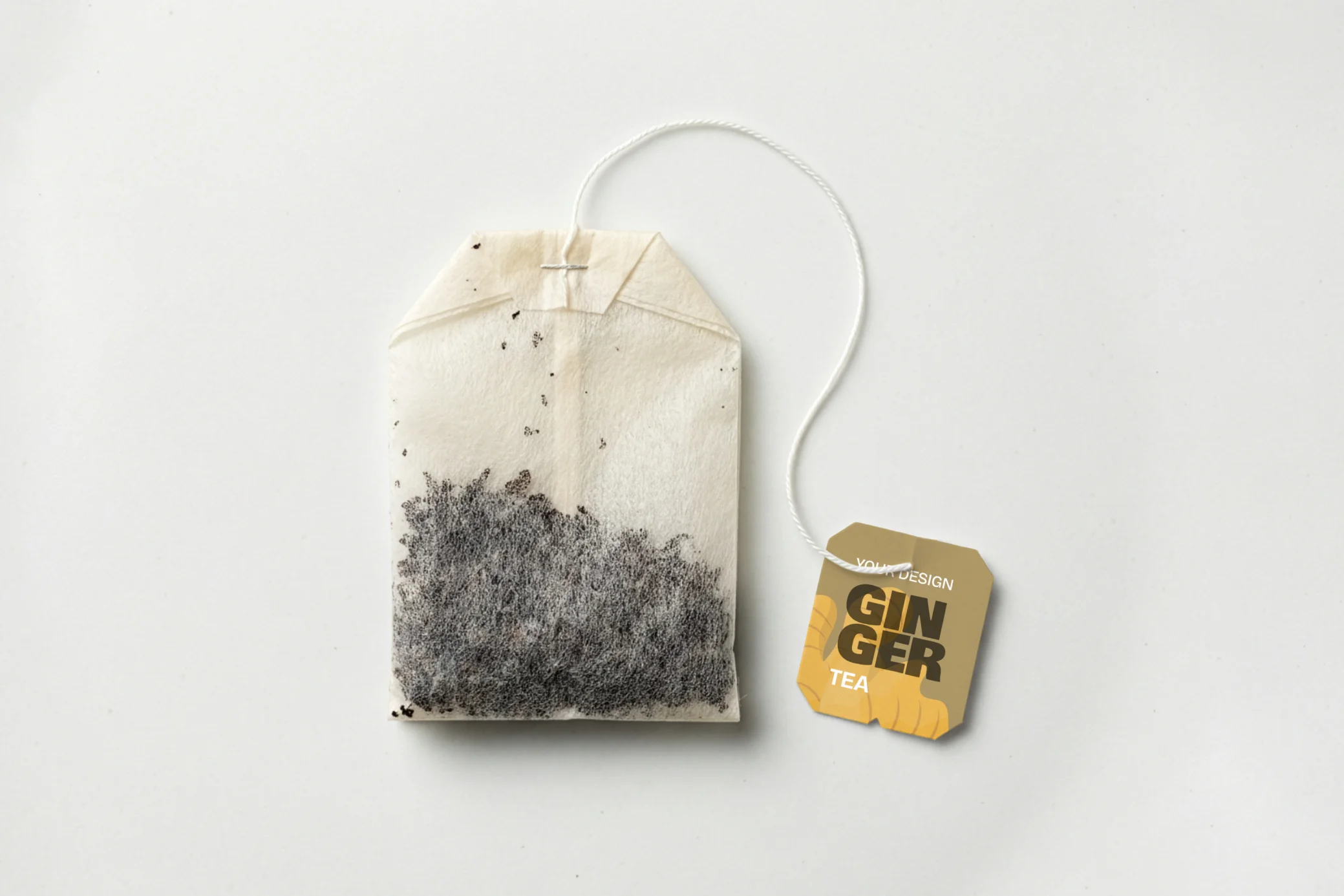 Tea bag mockup with customizable background and realistic paper tag packaging