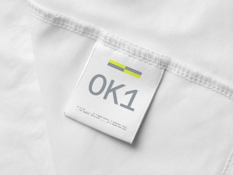 Customizable apparel label mockup with realistic fabric texture and stitched tag